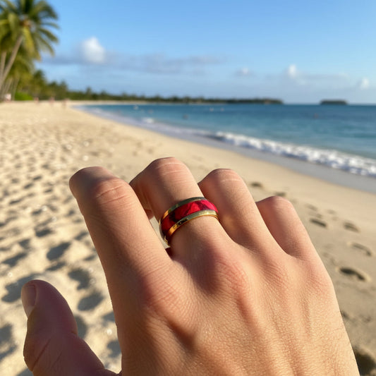 Hand with a ring on a beach