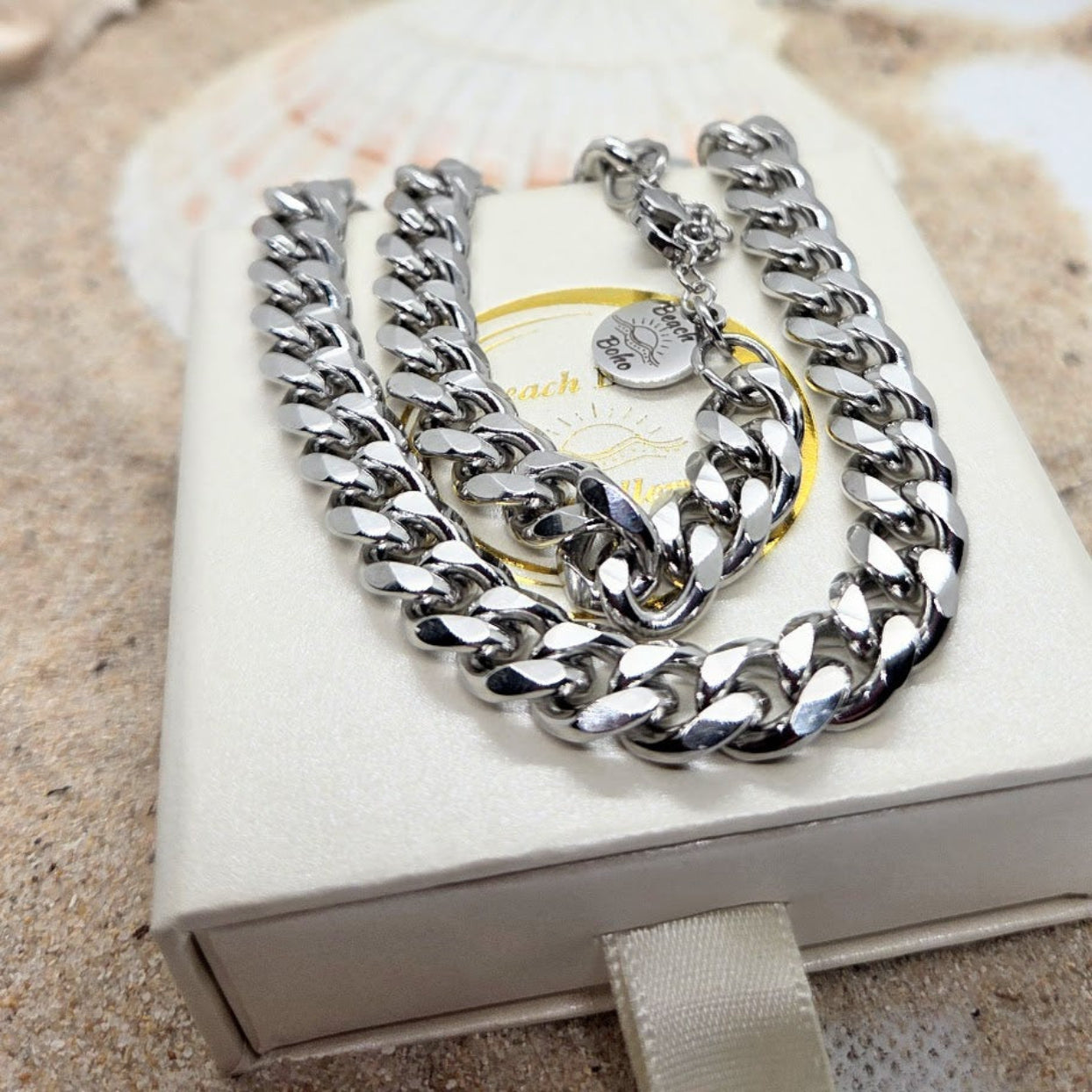 Silver chain necklace on a Coach branded box