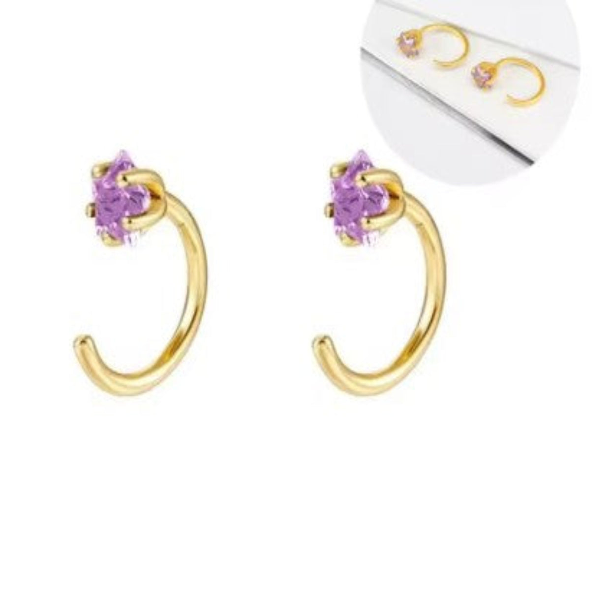 Gold hoop earrings with purple gemstones on a white background