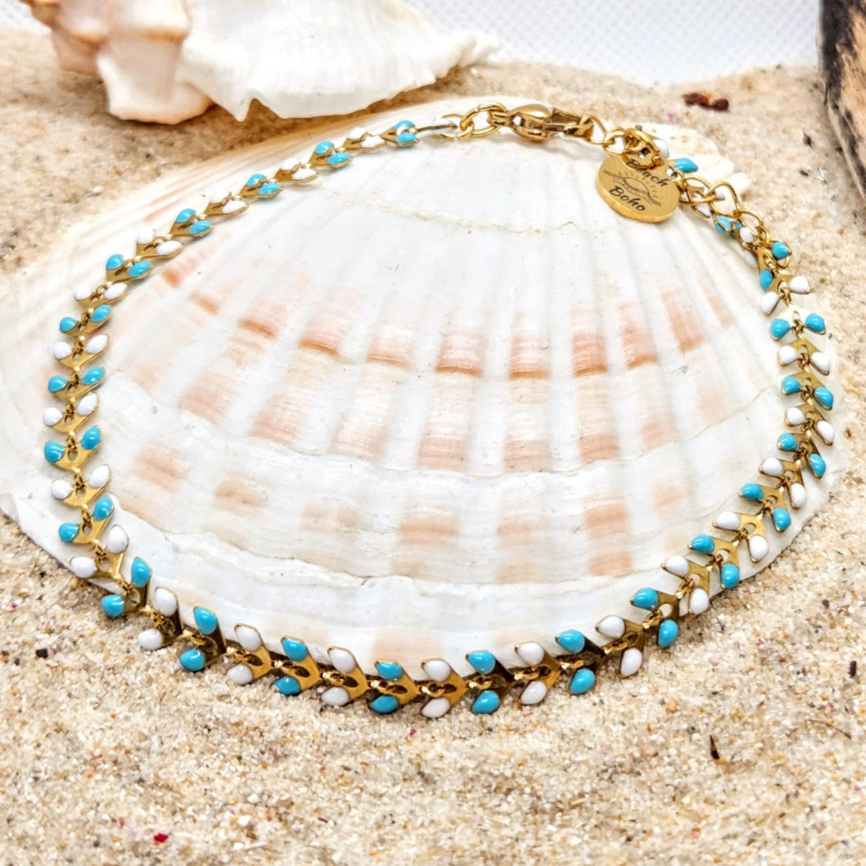 Necklace with blue and white beads on a seashell