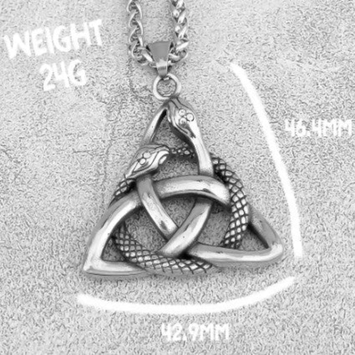 Triquetra pendant with snakes on a chain, shown with measurements on a textured gray background.