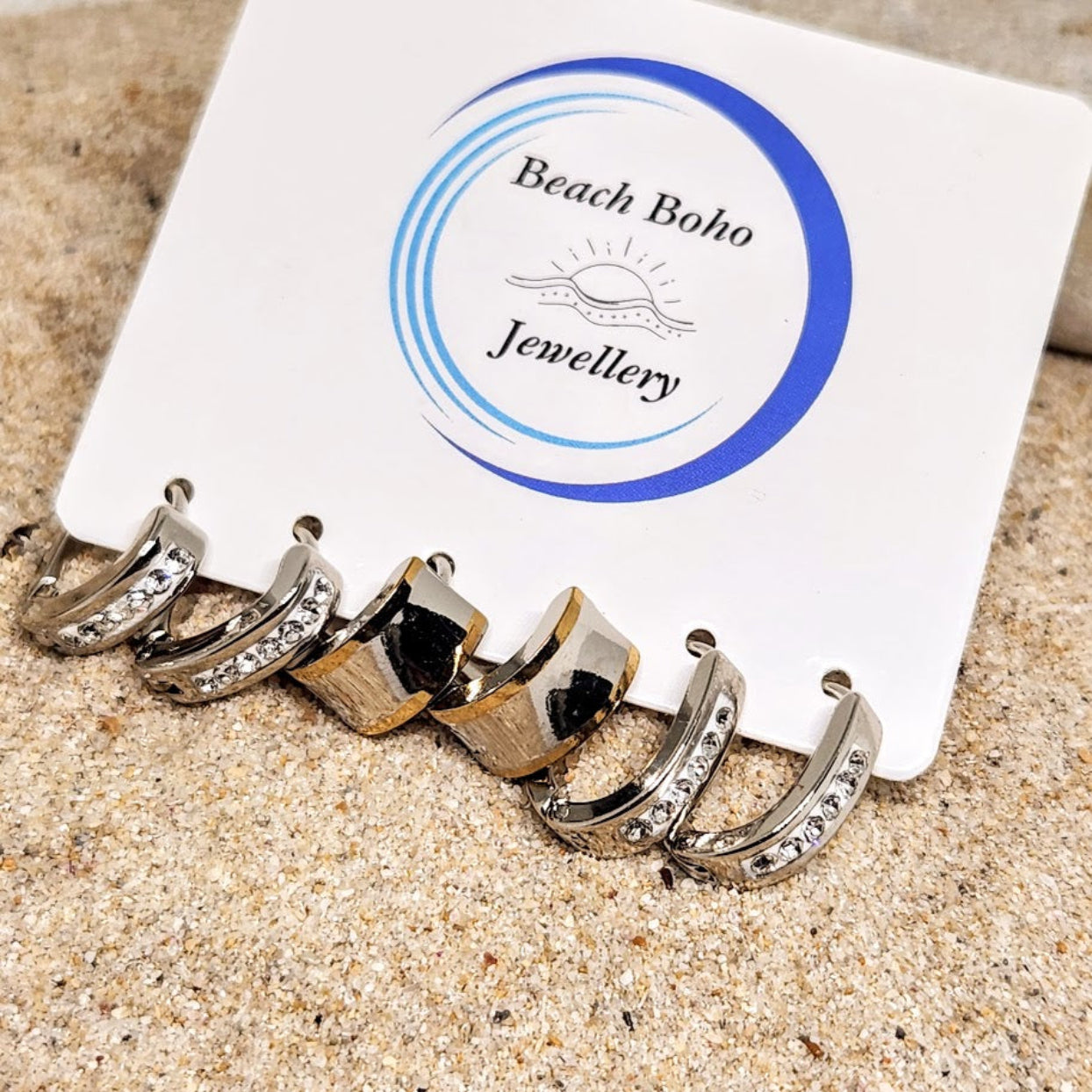 Set of hoop earrings on a 'Beach Boho Jewellery' branded card with sand background