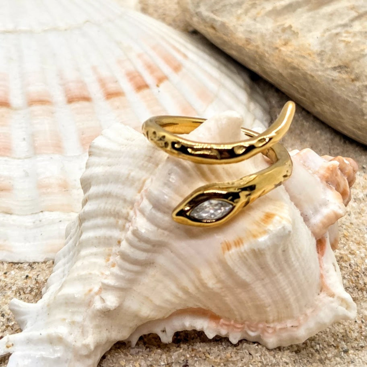 Gold ring with a diamond on a seashell