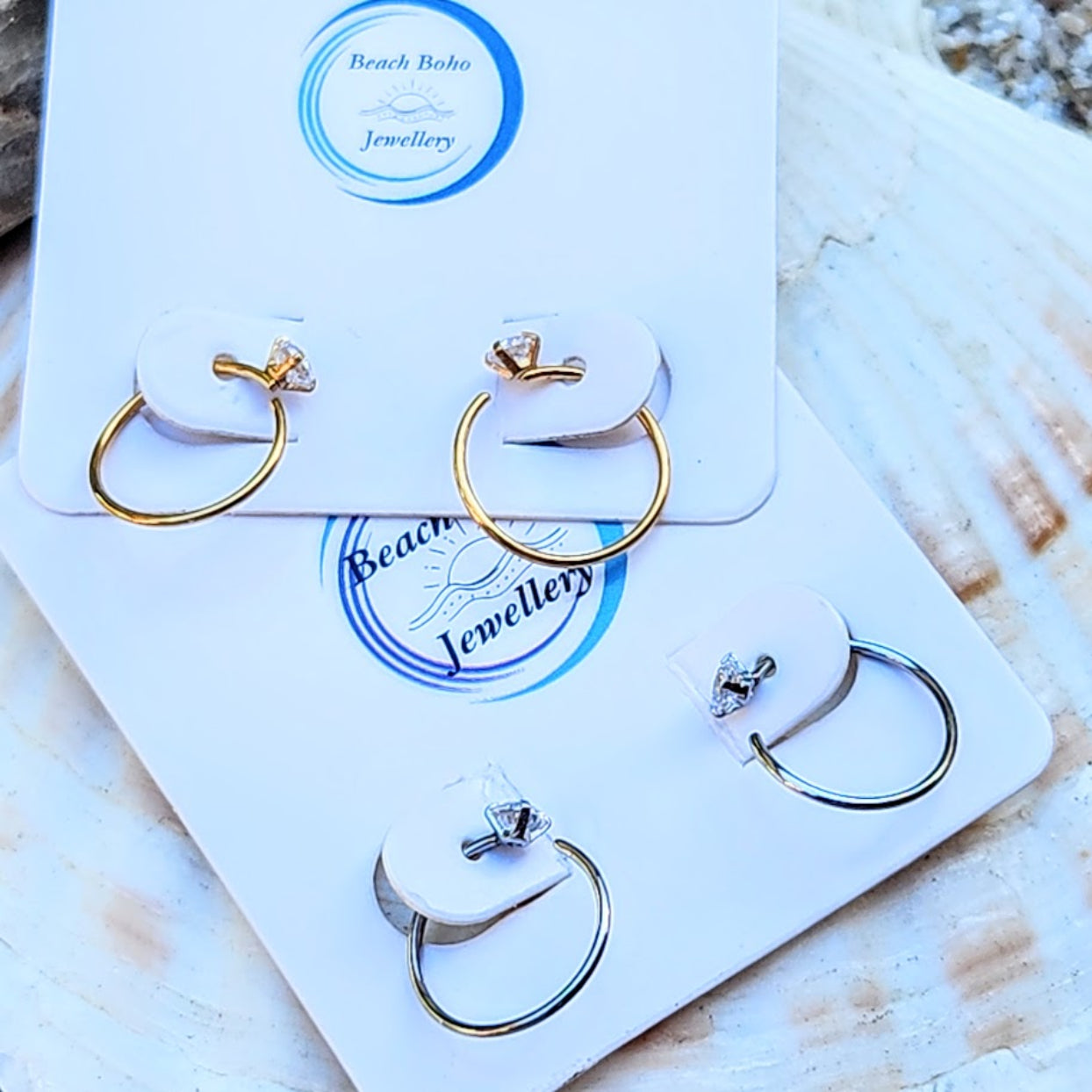 Gold and silver hoop earrings on a branded card with 'Beach Boho Jewellery' logo.