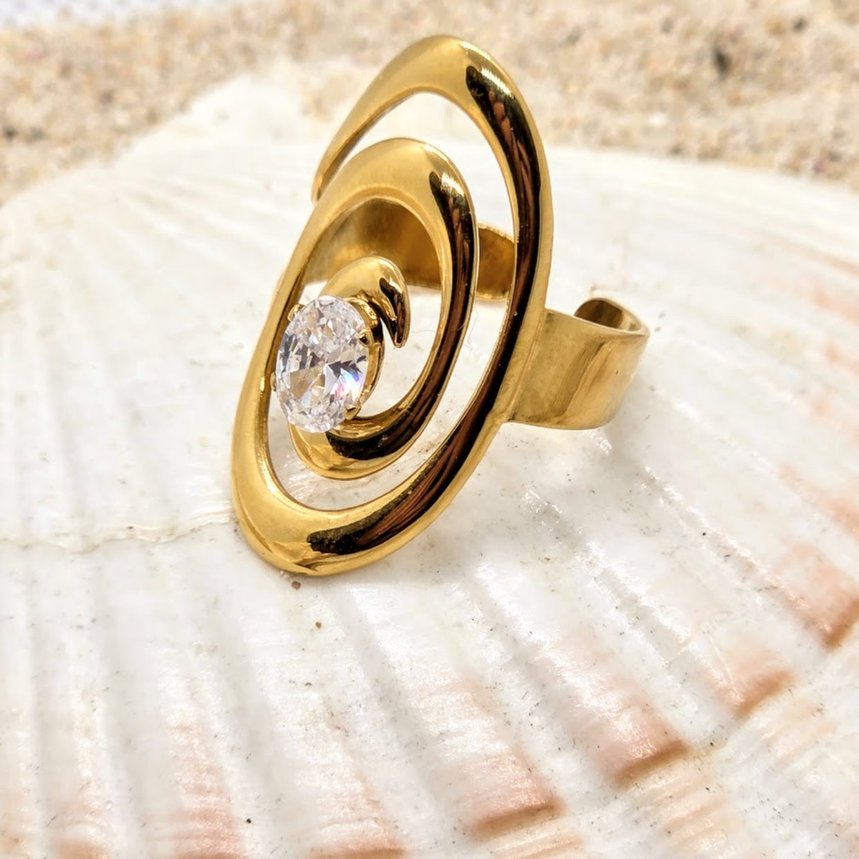 Gold ring with a diamond on a seashell