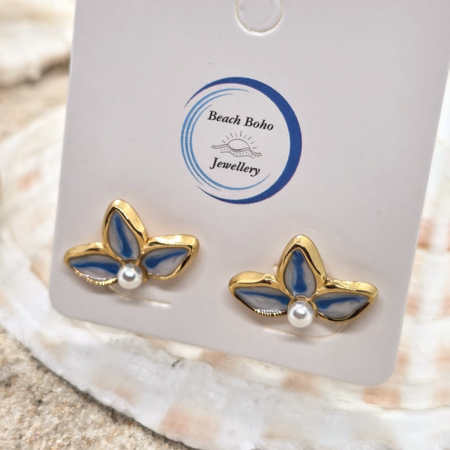 Butterfly-shaped earrings with gold and blue design on a Beach Boho Jewellery card.